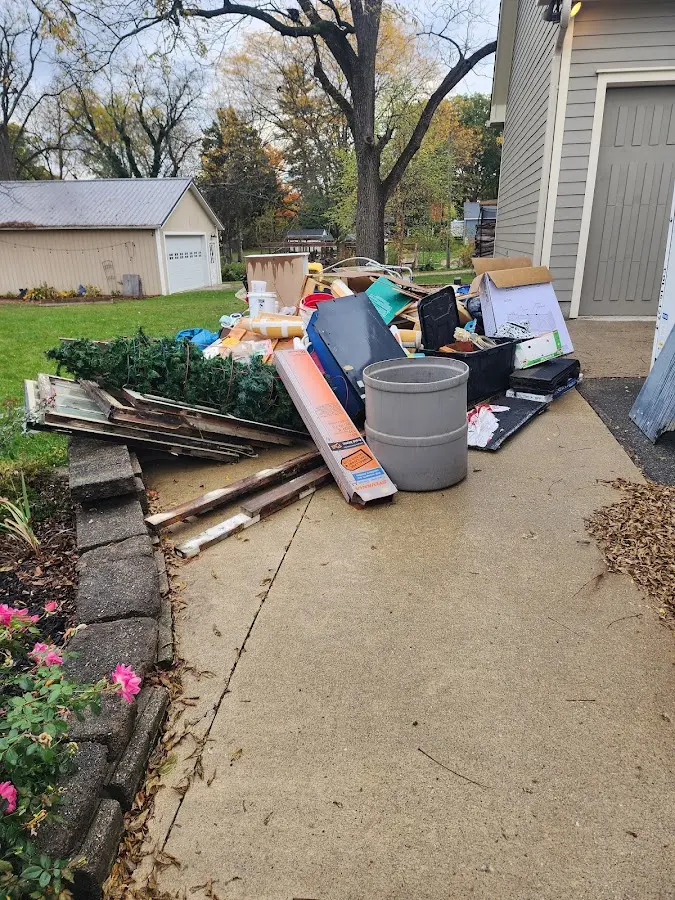 Dumpster being loaded with debris for Residential Dumpster Rental in Somerset